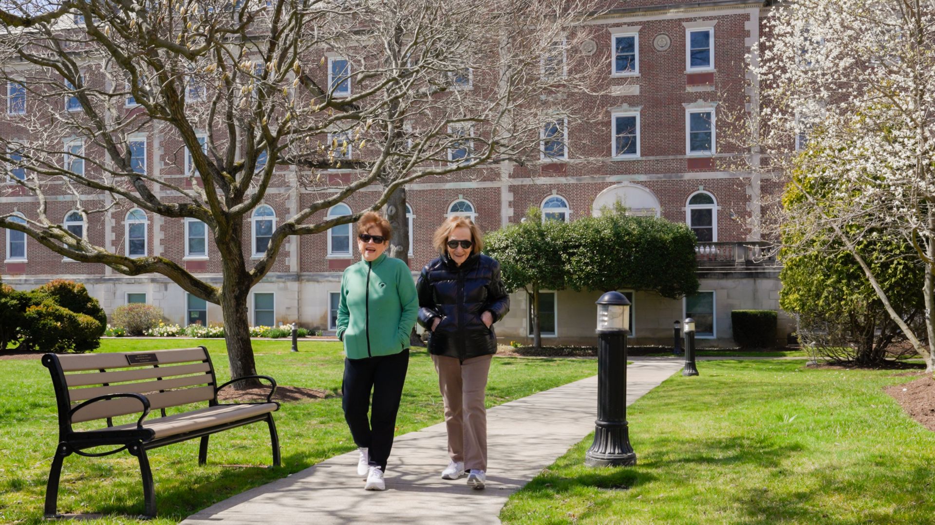 Two Osborn residents take a stroll on the Osborn's campus