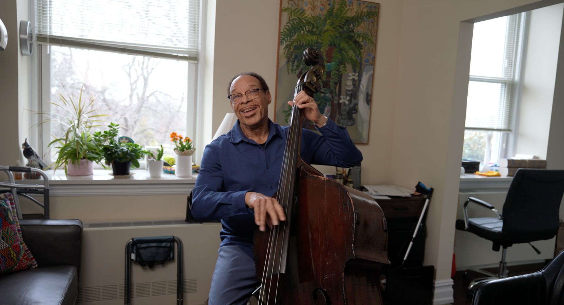 An Osborn resident shows off his bass playing skills
