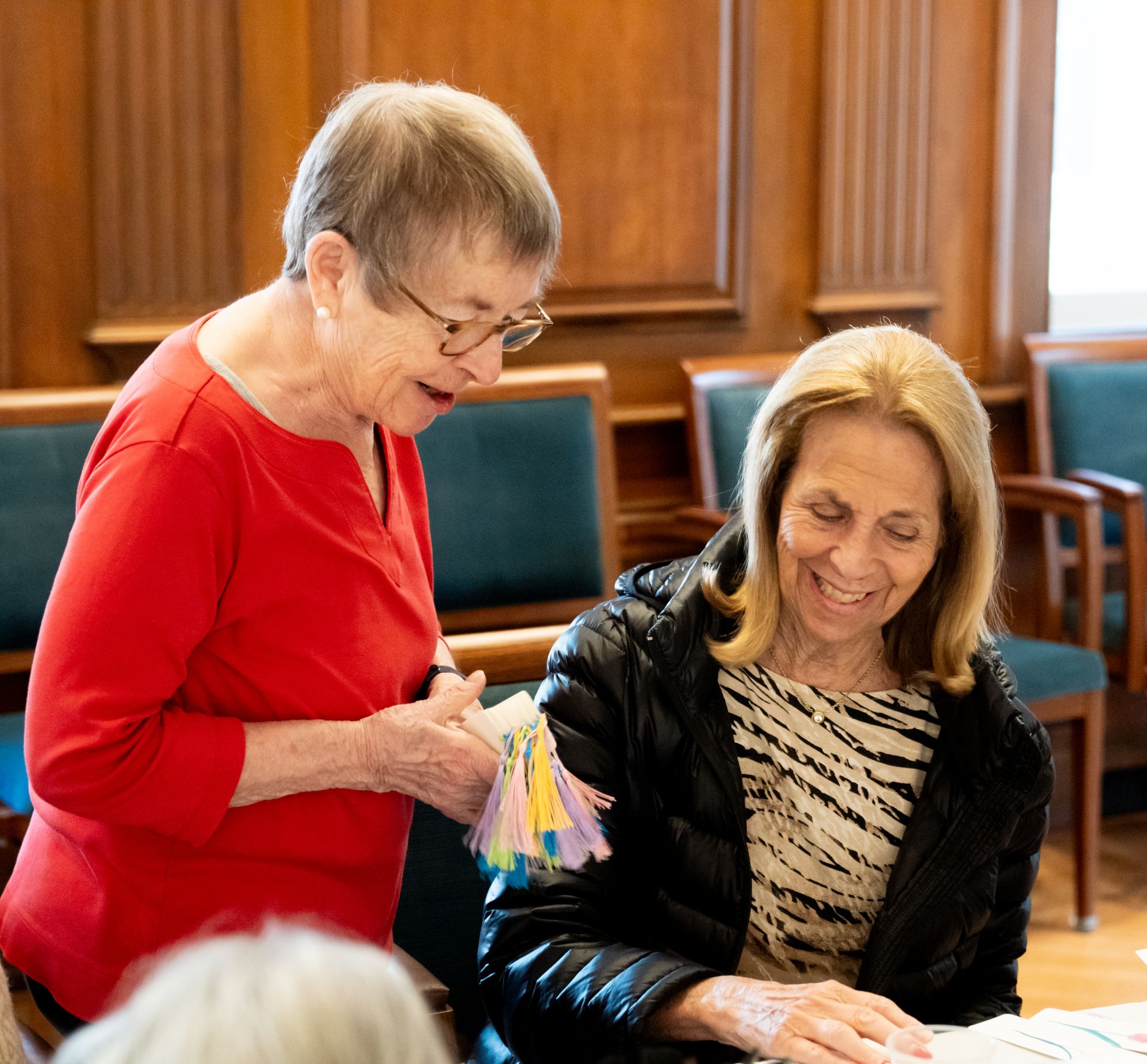 Residents of The Osborn work on arts and crafts together