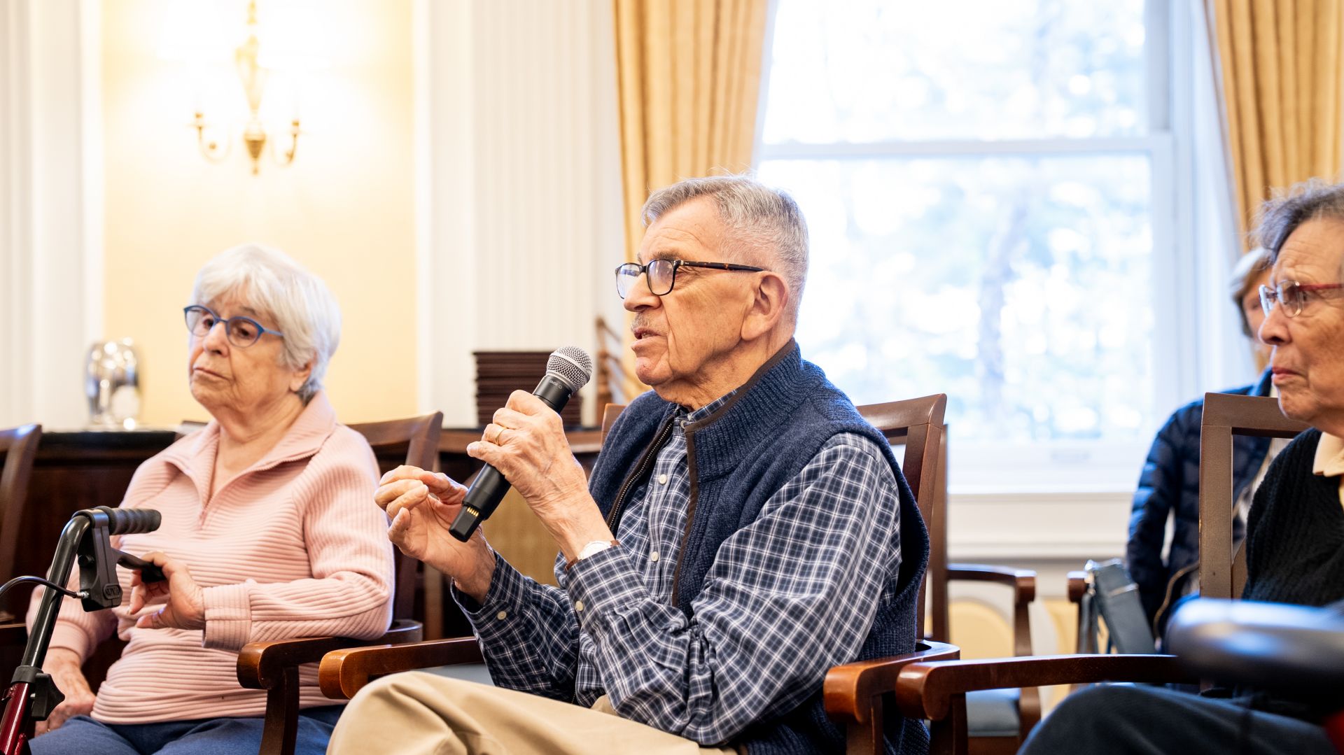 A resident of The Osborn takes the mic at a visiting lecture