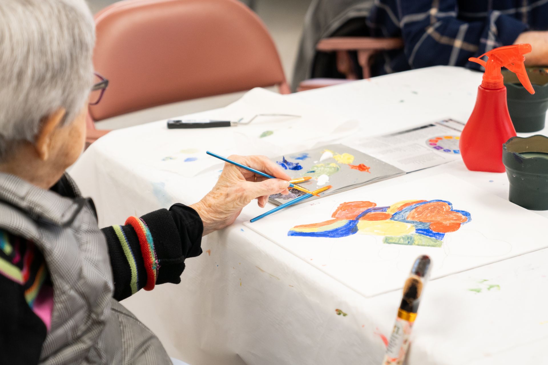 An Osborn resident paints in the on-campus art studio