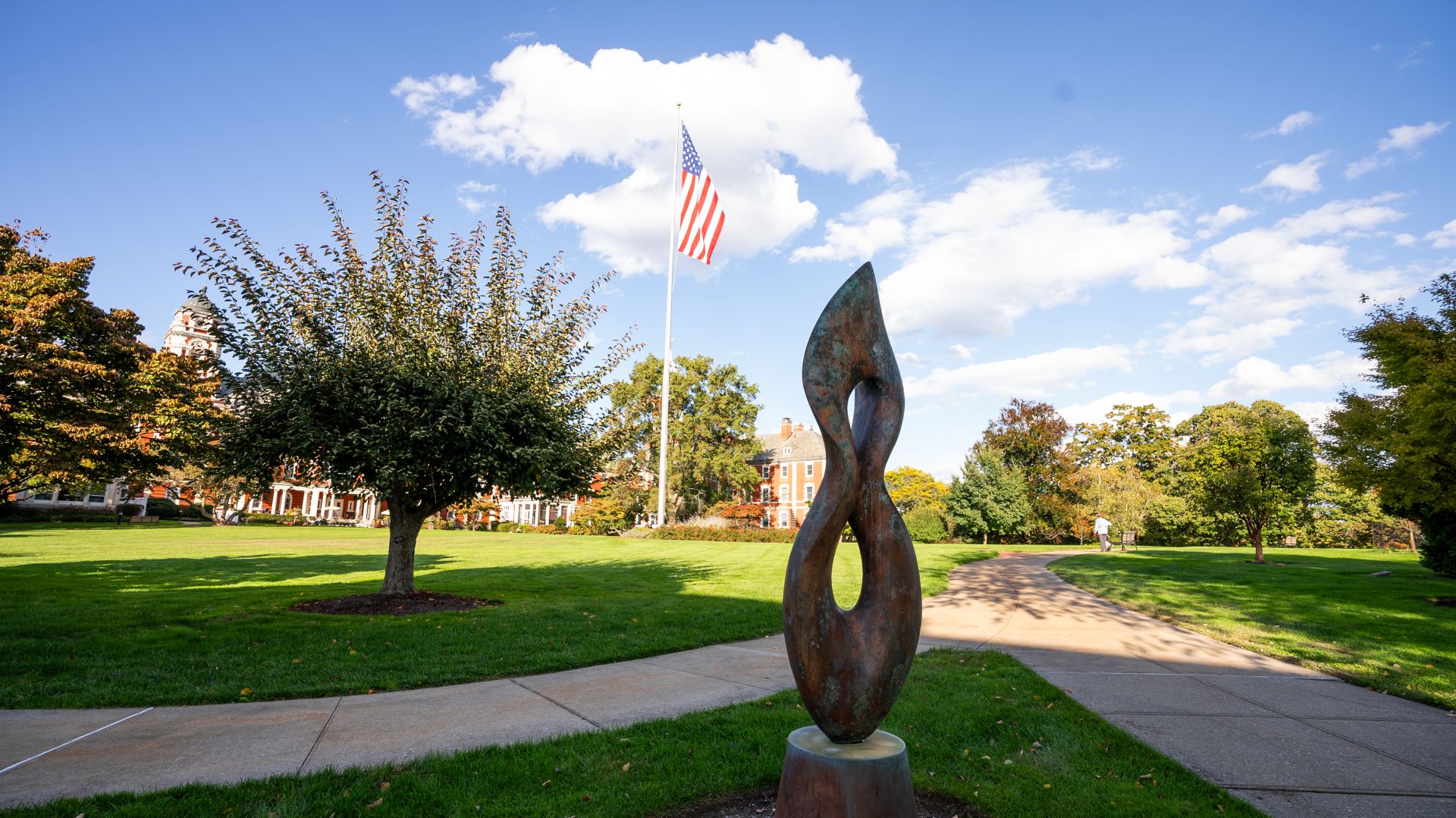 Exterior view of The Osborn showcasing sculpture and walking path