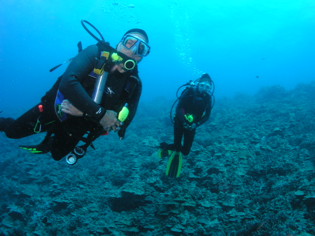 Osborn resident Dan Mailick scuba diving alongside his daughter Rachel over a coral reef