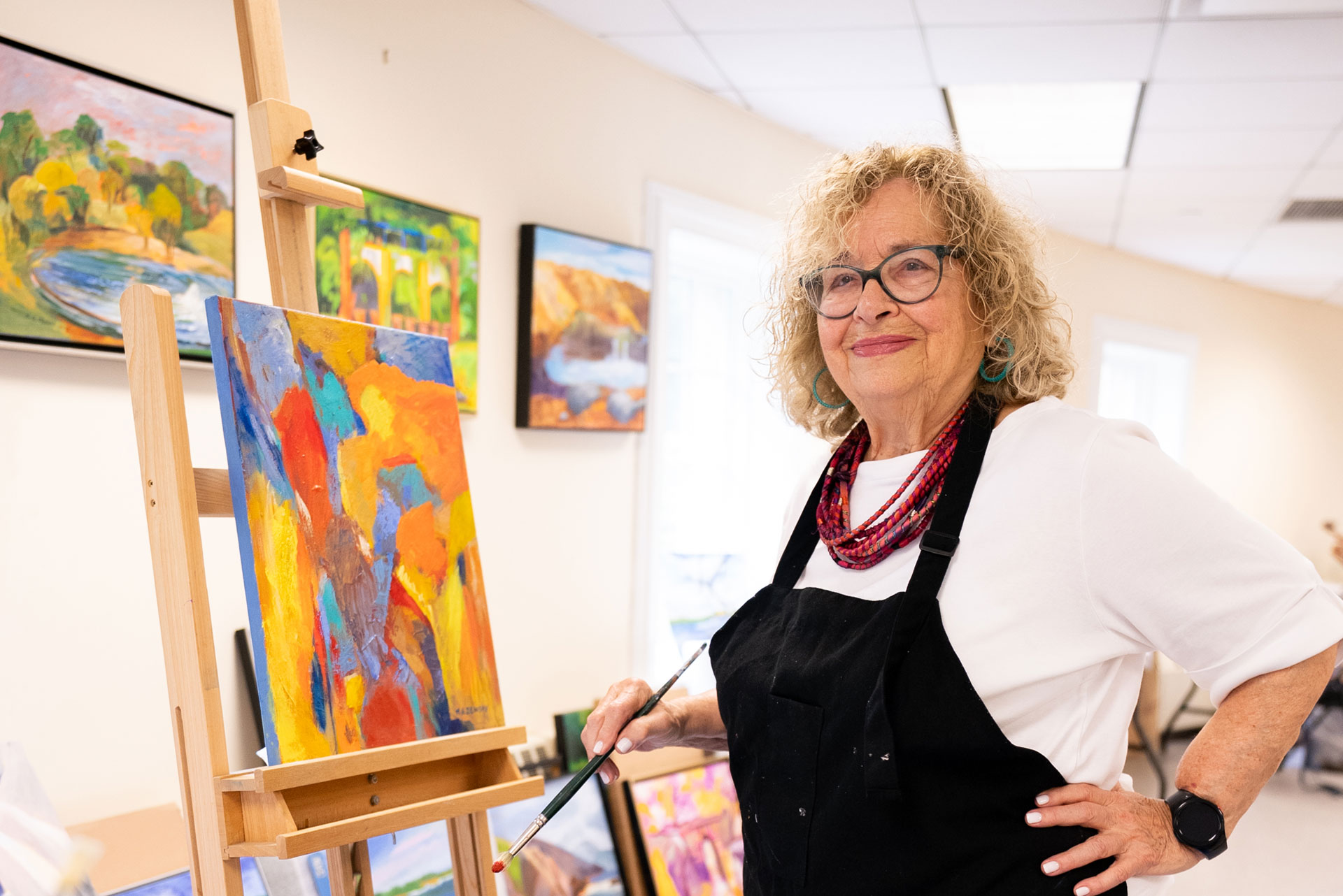 Resident artist in the art studio at The Osborn's assisted living community