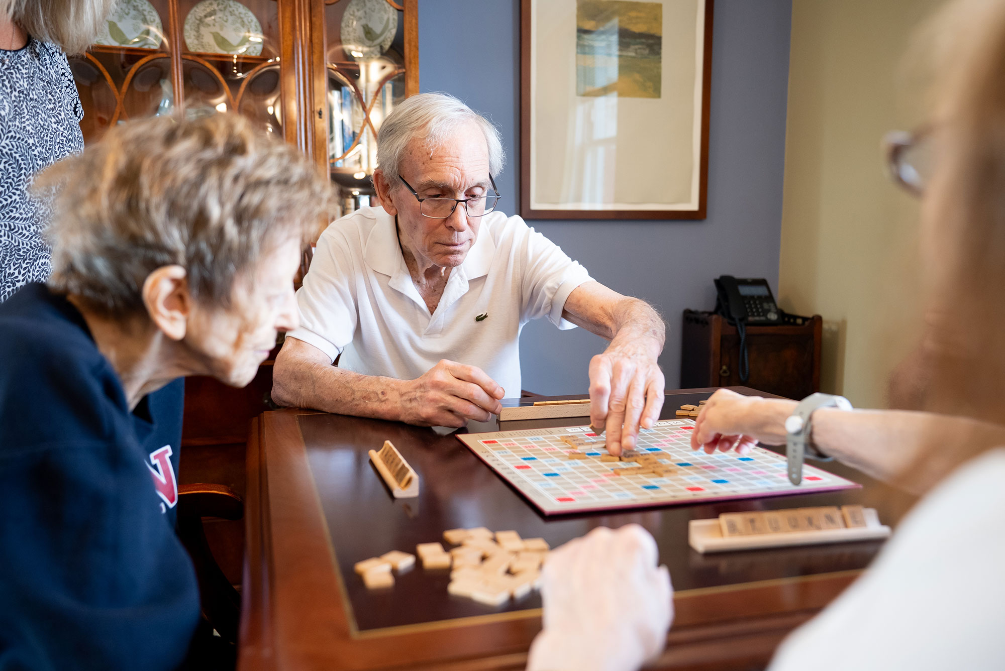 Residents playing a word game together in assisted living at The Osborn