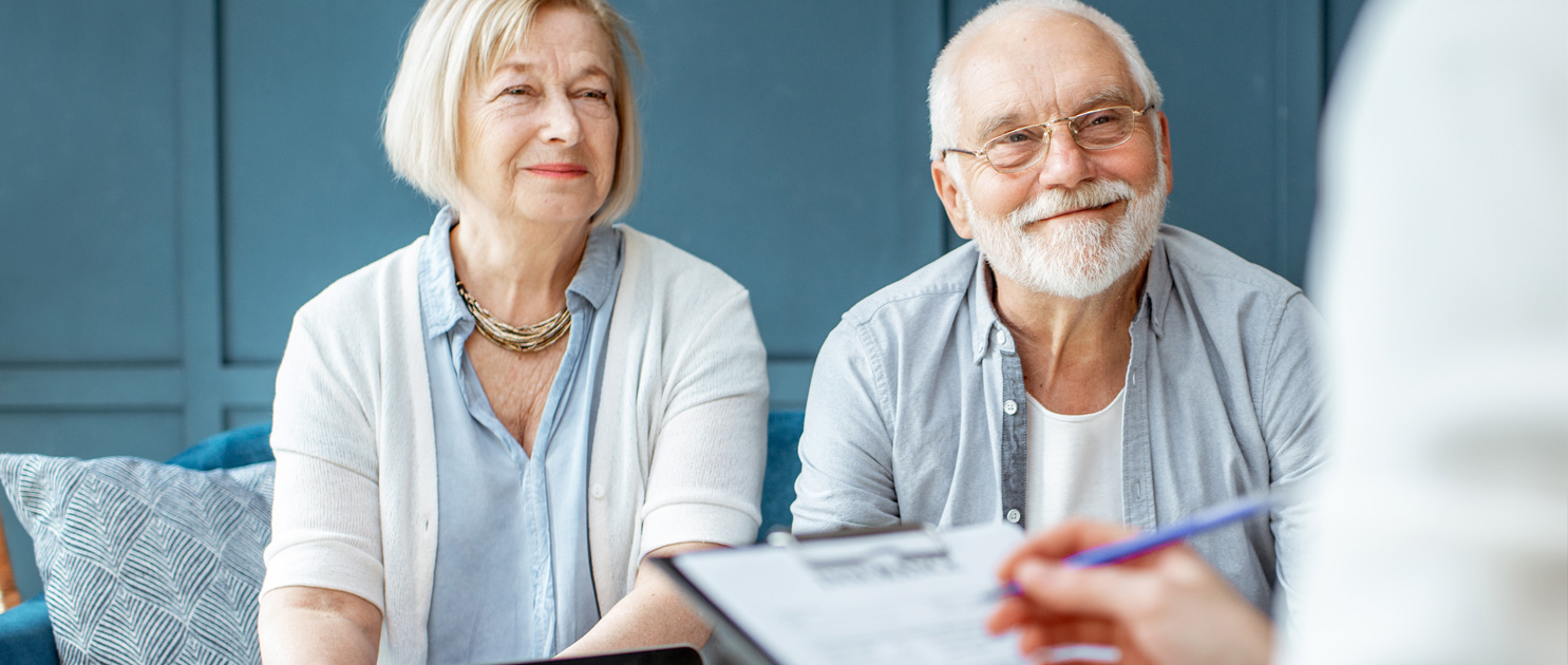 Adulting 2.0: What You Need to Know to Prepare for Successful Aging Older couple reviewing estate planning and downsizing documents at home before The Osborn's estate planning seminar